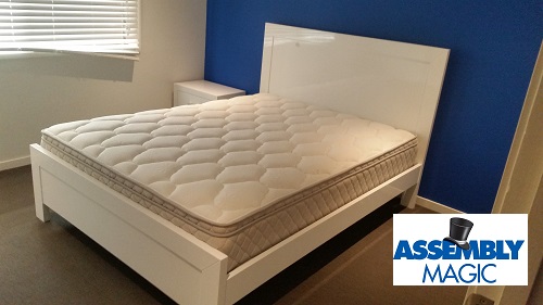 Queen size bed assembled by Assembly Magic. Logo in bottom right corner