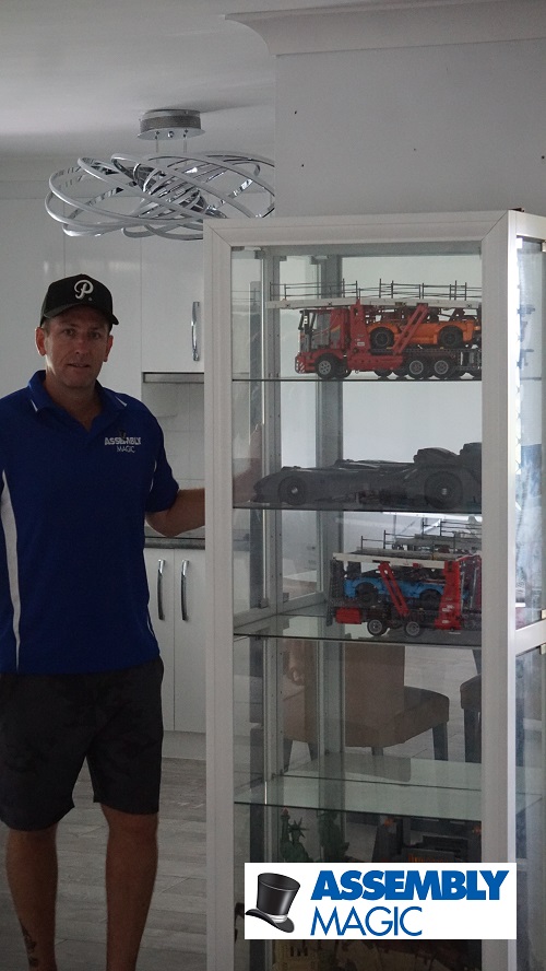 Technician Ben, next to a flat pack he built for a Lego collector