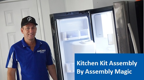 Technician - Ben, standing next to a refrigerator