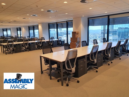 new office furniture assembled - conference room setup. Assembly Magic logo in bottom left corner