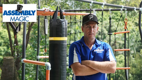 Technician - Ben in front of a playground he assembled