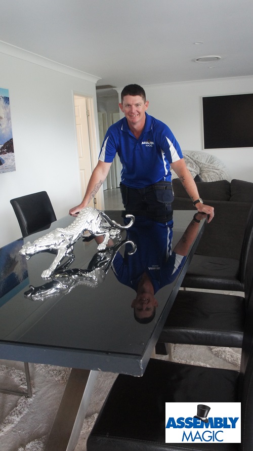 Technician - Brendan, standing in front of a dinging suite he delivered