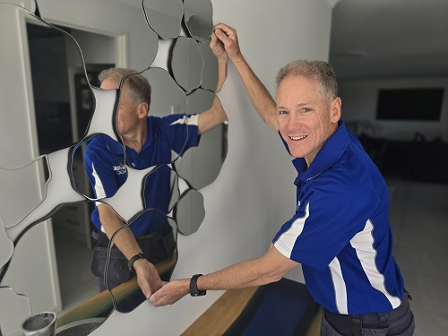 Mirror hanging service by Assembly Magic