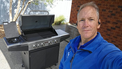 Technician - Robert, with a BBQ he assembled.