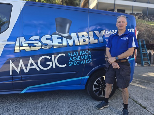 Robert standing next to his Assembly Magic vehicle