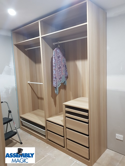 A newly assembled Wardrobe flat pack with Assembly Magic logo in bottom left corner