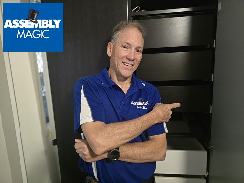 Technician pointing at furniture he assembled