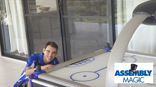 Technician - Shaun with an air hockey table he assembled
