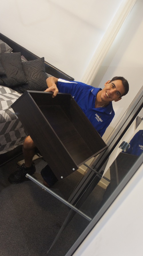 Technician Shaun with Storage unit he assembled.