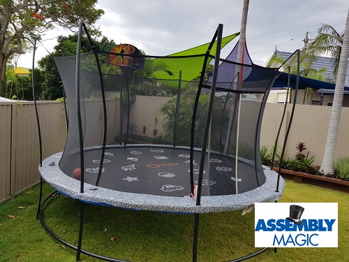 Large trampoline with safety net. Assembly Magic logo in bottom right corner