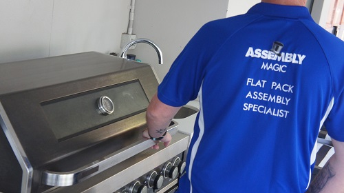 Technician working on a BBQ Installation.