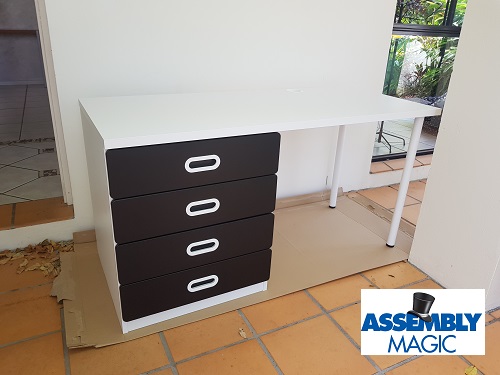 Desk assembled by Assembly Magic. Logo bottom left