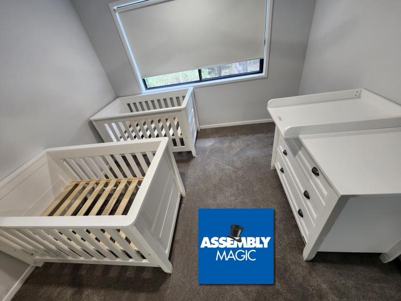 Two cots and change tab les for twins and Assembly Magic Logo