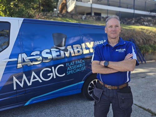 Technician - Robert, next to his Assembly Magic van.