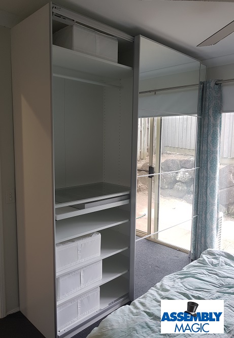 Large wardrobes assembled by Assembly Magic. Logo in bottom right corner