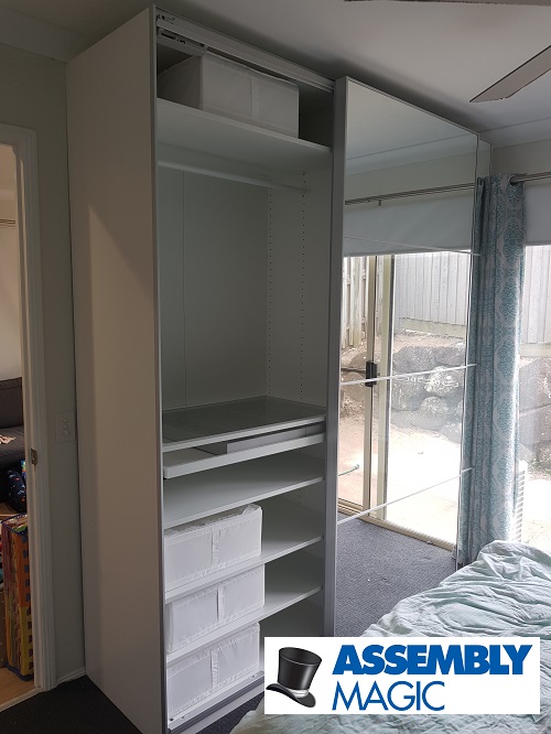 Large wardrobe assembled by Assembly Magic. Logo in bottom right corner