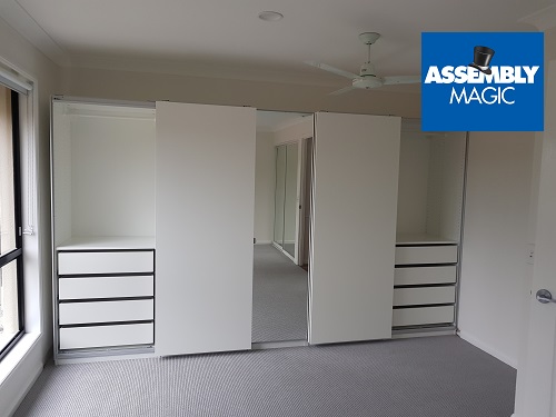 Large wardrobes assembled by Assembly Magic. Logo in top right corner